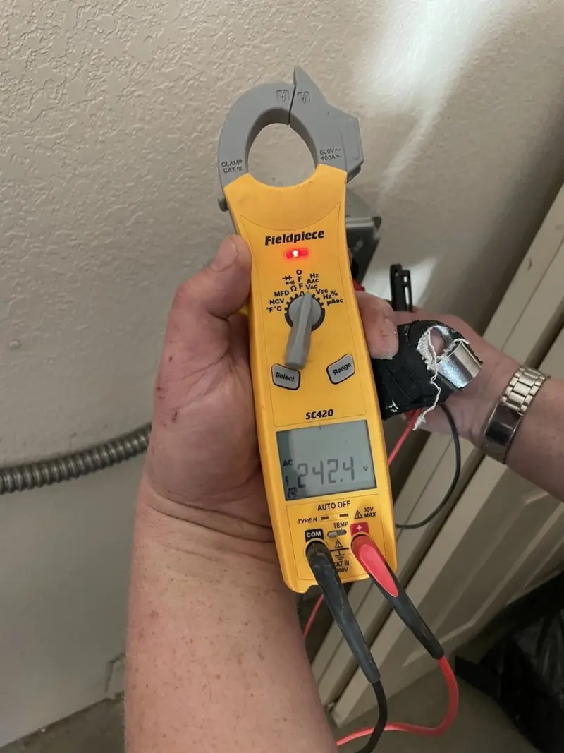 Voltage testing with clamp meter during Recessed Lighting Installation in Peshtigo